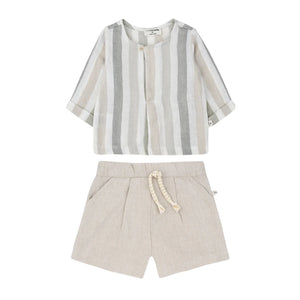 Striped shirt and beige shorts set on a white background