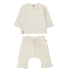 A breathtaking 1+ in the Family Ecru Set featuring the Mathias Henley and Ramon Lined Pants, showcasing its authoritative architectural fit.