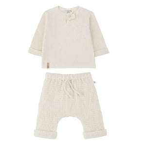 A breathtaking 1+ in the Family Ecru Set featuring the Mathias Henley and Ramon Lined Pants, showcasing its authoritative architectural fit.