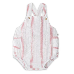 A high-end 1+ in the Family Portitxol Romper in a soft neutral textured knit, showcasing the modern architectural drape and minimalist boutique finish.