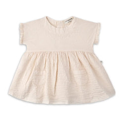 A minimalist 1+ in the Family Troya Dress in a neutral tone, featuring a high-volume flared silhouette and premium textured fabric.