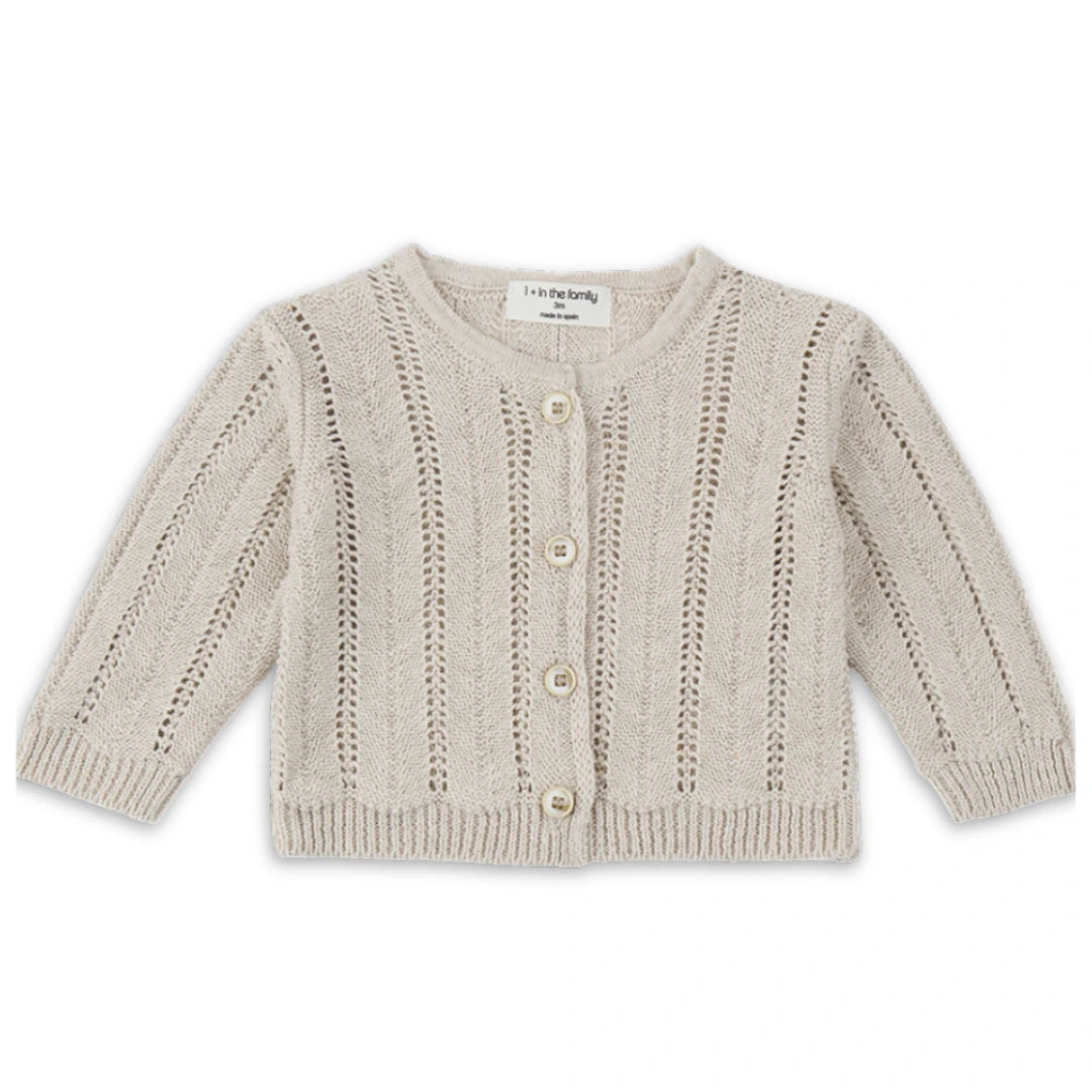 A sophisticated 1+ in the Family Xelida Jacket in a muted beige tone, showcasing its structured silhouette and high-end boutique finish.