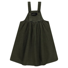 Green pinafore dress on a white background
