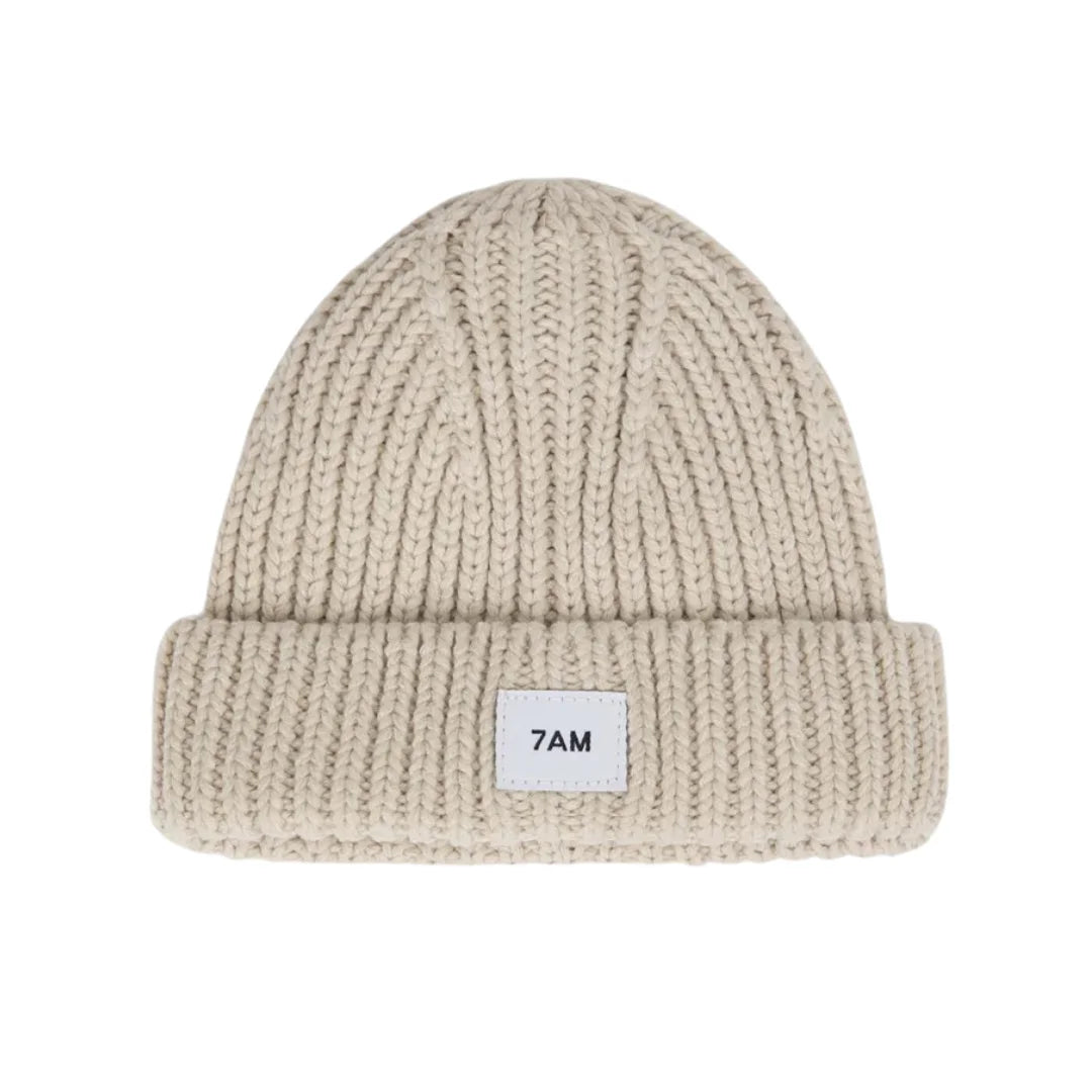 A flat-lay view of the 7AM Enfant chunky beanie in sand.