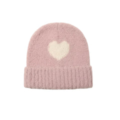 A flat-lay view of the 7AM Enfant hood bonnet in ash rose and ecru.