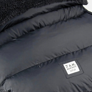 A high-resolution close-up of the plush fleece lining and harness slots.