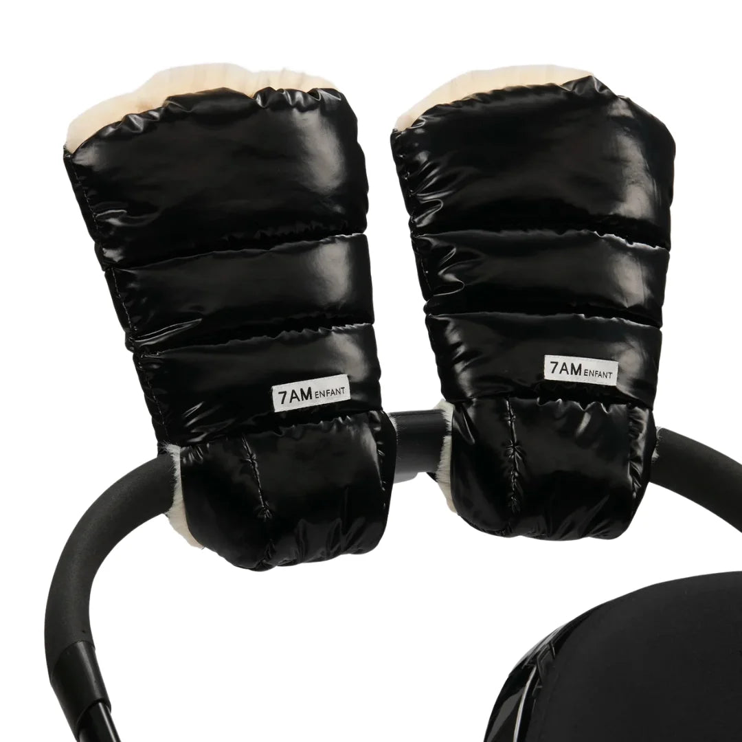 A flat-lay view of the 7AM Enfant Warmmuffs 212 in black liquid shine and arctic white faux fur.