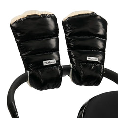 A flat-lay view of the 7AM Enfant Warmmuffs 212 in black liquid shine and arctic white faux fur.