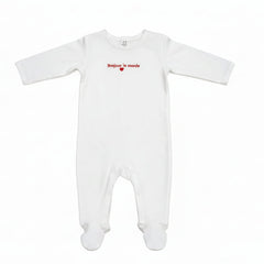 White baby onesie with red text on a white background