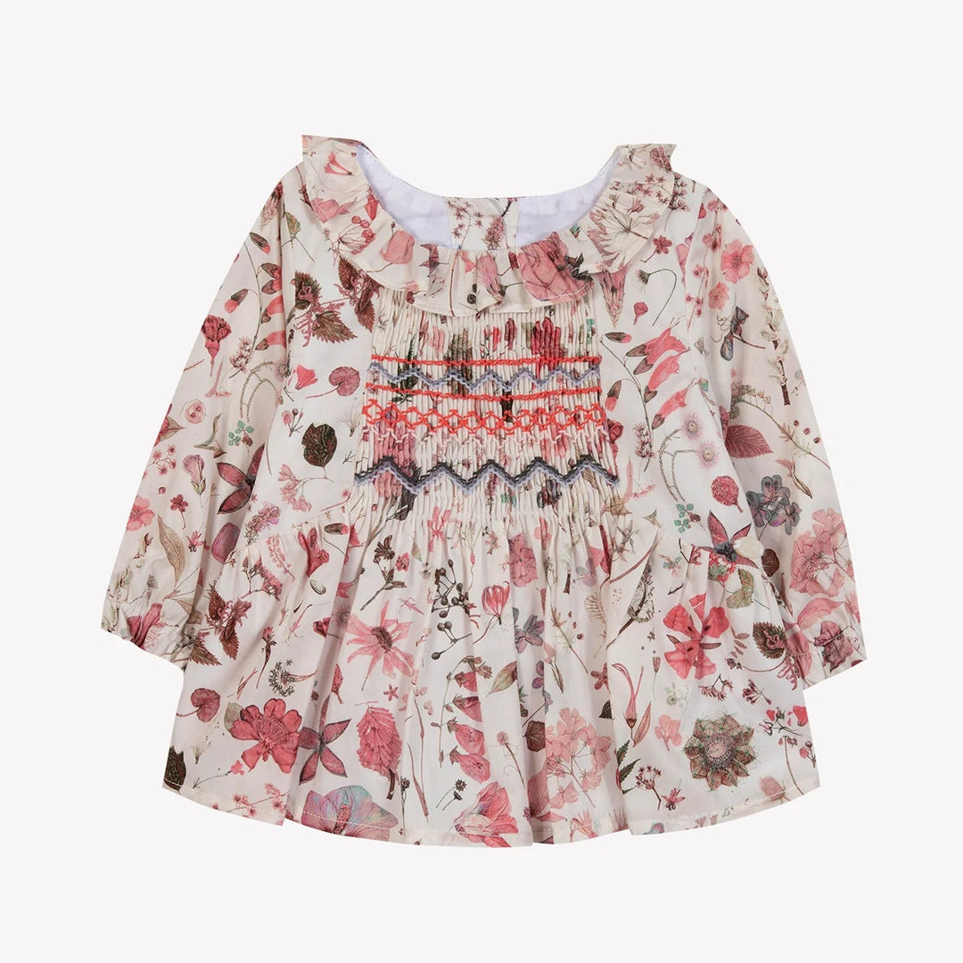 Floral dress with long sleeves on a white background