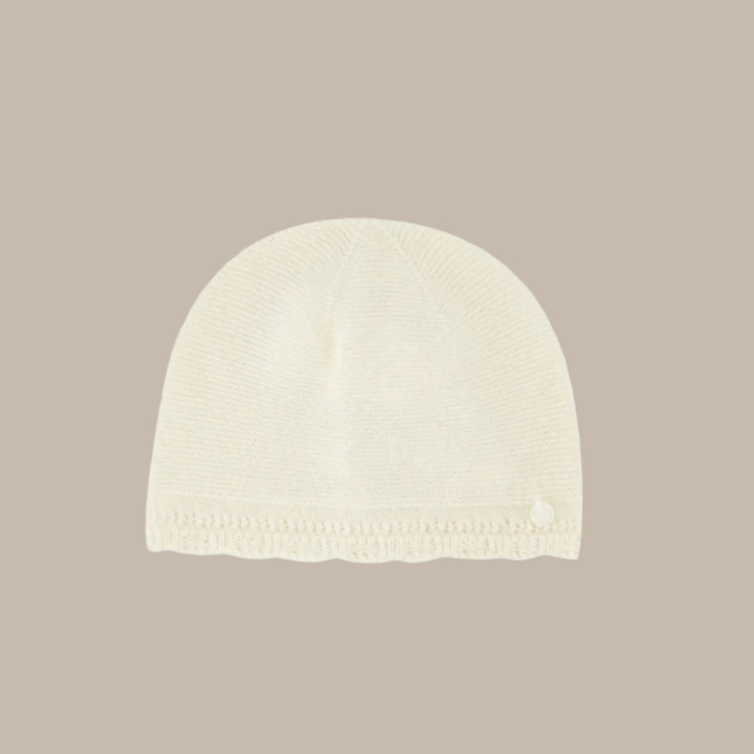White knit beanie on a white background