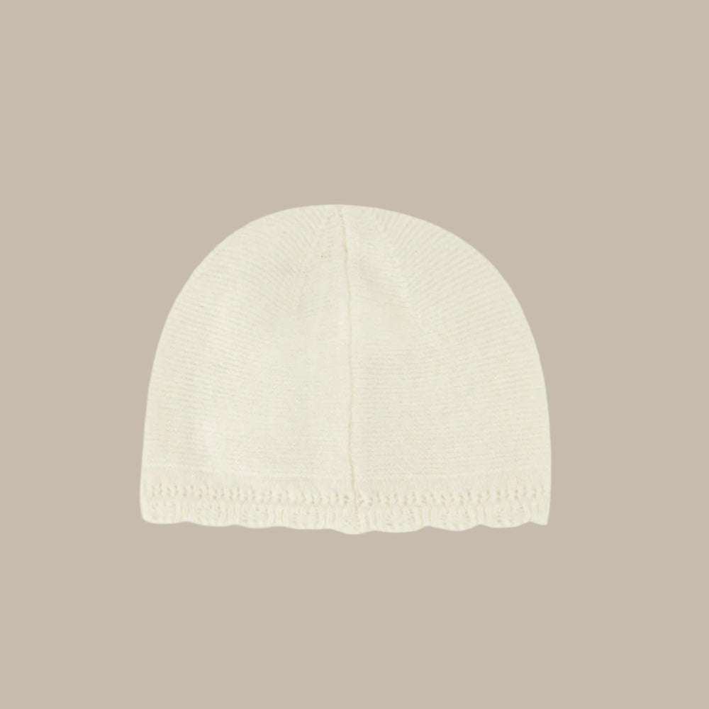 White knit beanie on a white background