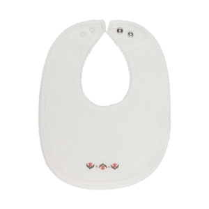 White baby bib with a small design on a white background