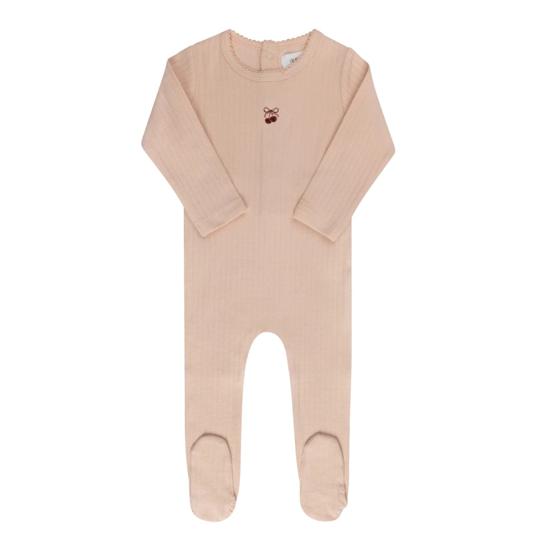 A delicate Ely’s & Co. Pointelle Bow Print Footie in a soft pink hue, showcasing the intricate textured knit and minimalist bow pattern.