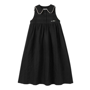 Black dress with white trim on a white background