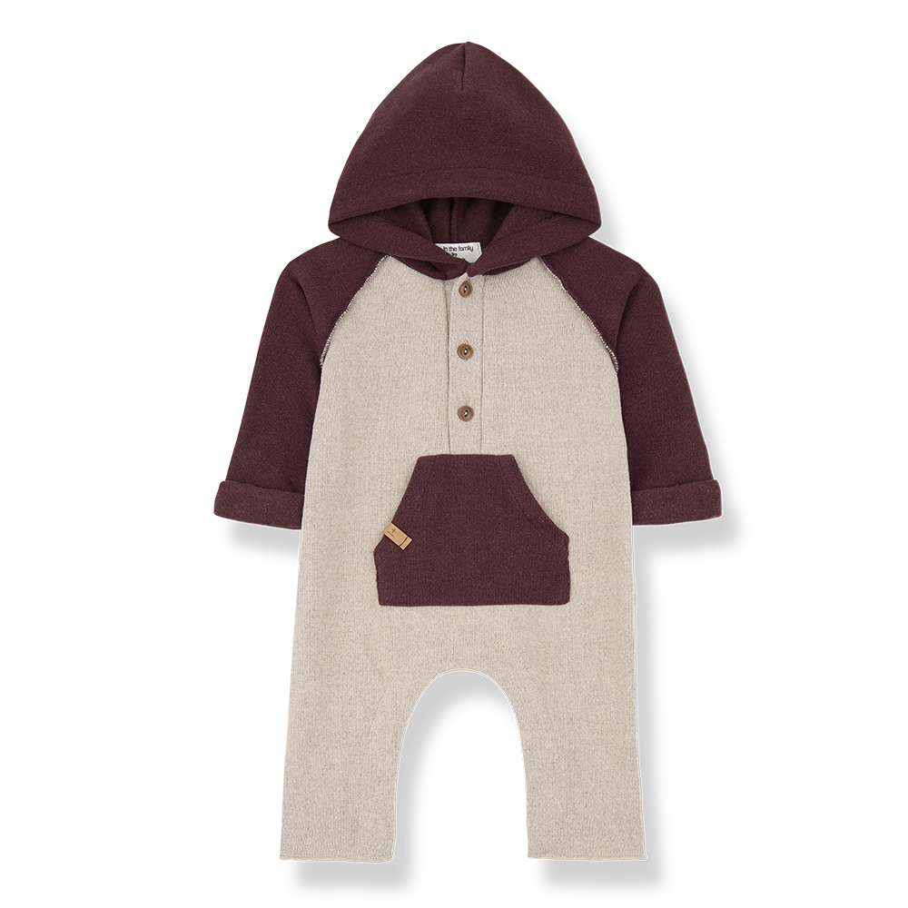 Baby romper with maroon sleeves and hood on a white background