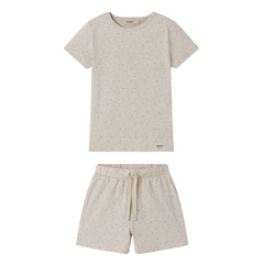 Beige pajama set with short-sleeve top and shorts on a white background