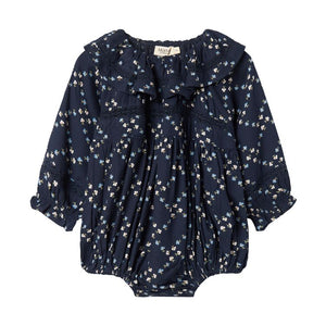 Navy blue baby romper with floral pattern on a white background