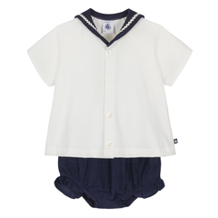 White shirt with navy trim and matching navy bloomers on a white background