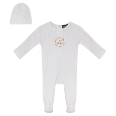 White baby onesie with colorful design and matching hat on a white background