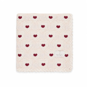 A neatly folded presentation showcasing the heart knit pattern and texture.