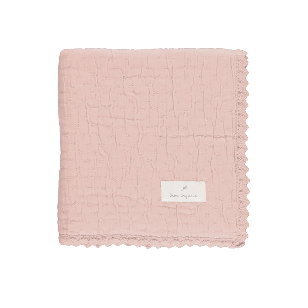 A front view of the Bebe Organic Lumi chenille baby blanket dusty rose