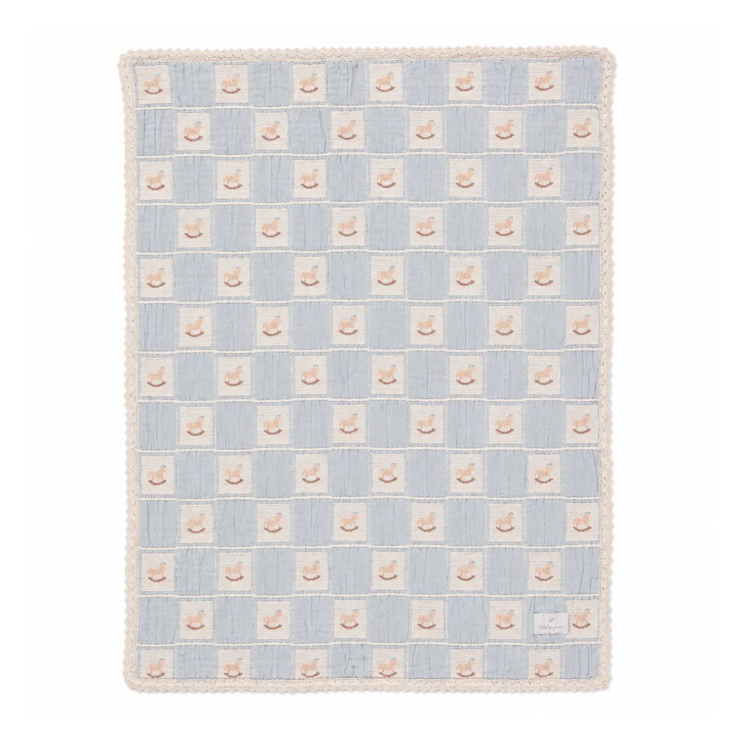 A front view of the Bebe Organic rocking horse patchwork organic cotton baby blanket blue