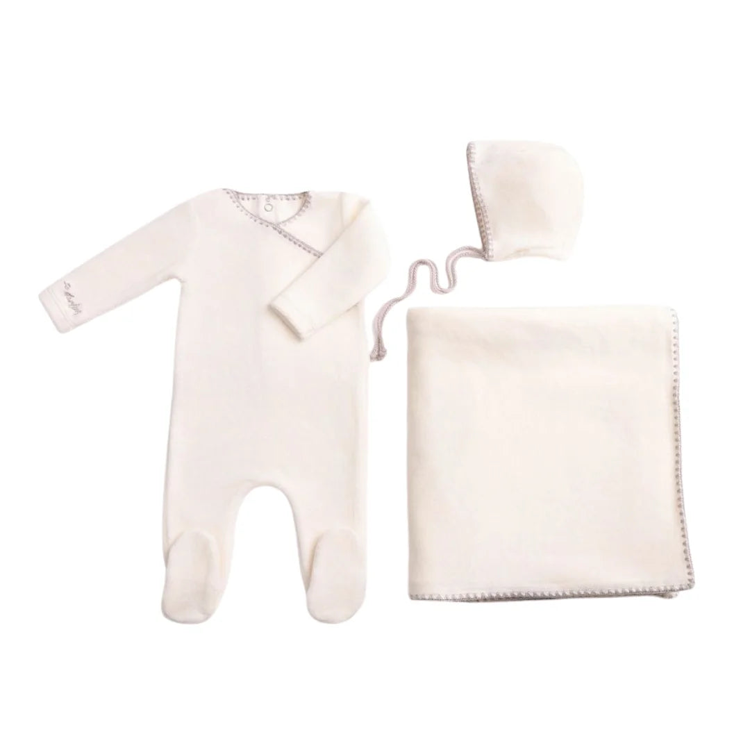 A front view of the luxurious chalk white Bee & Dee velour footie and bonnet full set