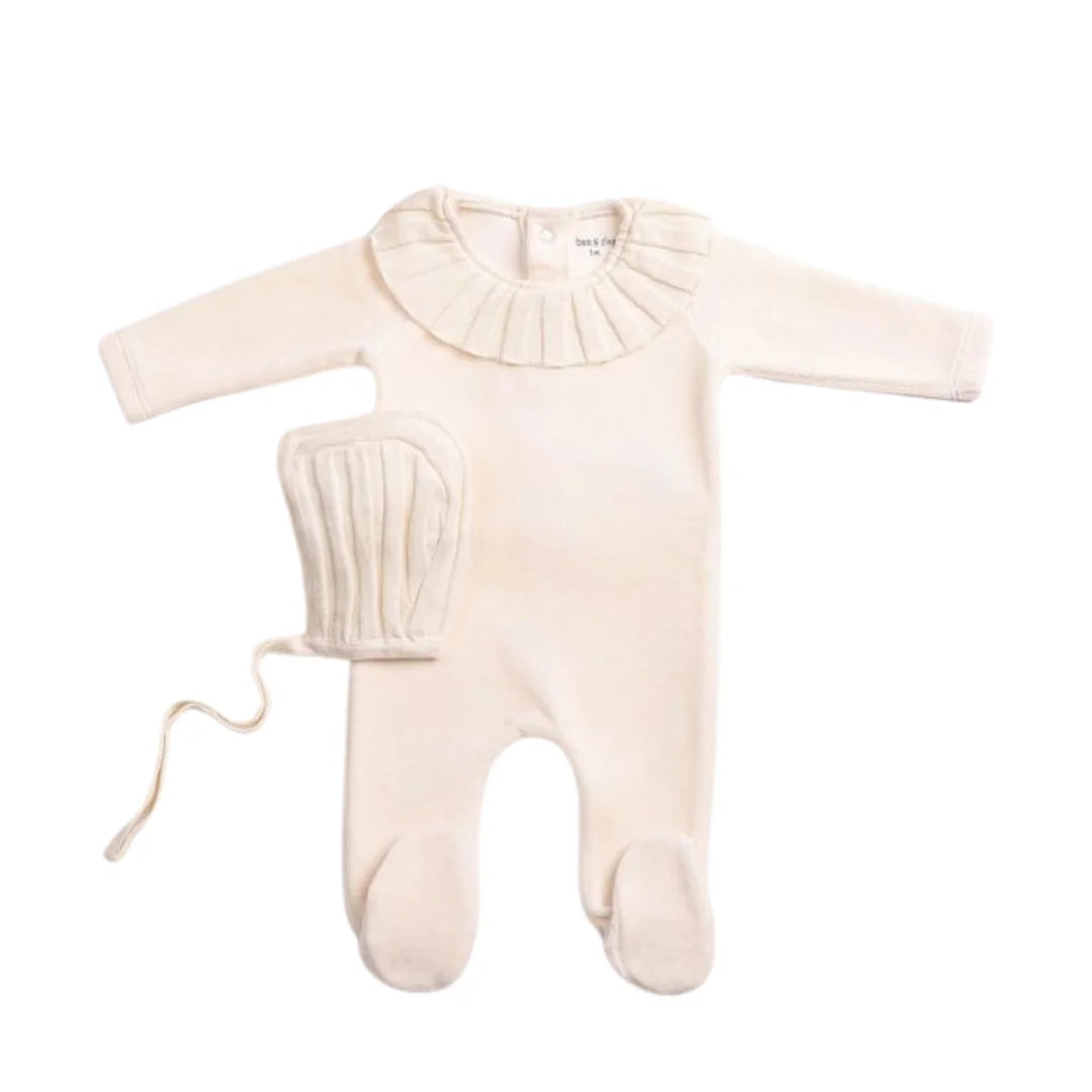 A front view of the elegant linen Bee & Dee Pleated Knit footie and bonnet.