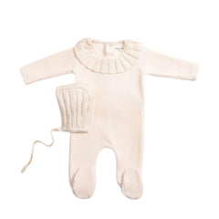 A front view of the elegant linen Bee & Dee Pleated Knit footie and bonnet.