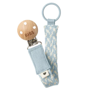 BIBS pacifier clip with wooden pacifier on a white background