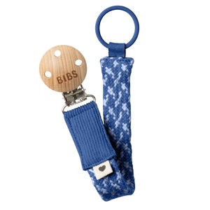 BIBS wooden pacifier clip with blue woven strap on a white background