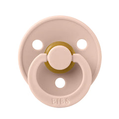 Pink pacifier with gold ring and 'BIBS' branding on a white background