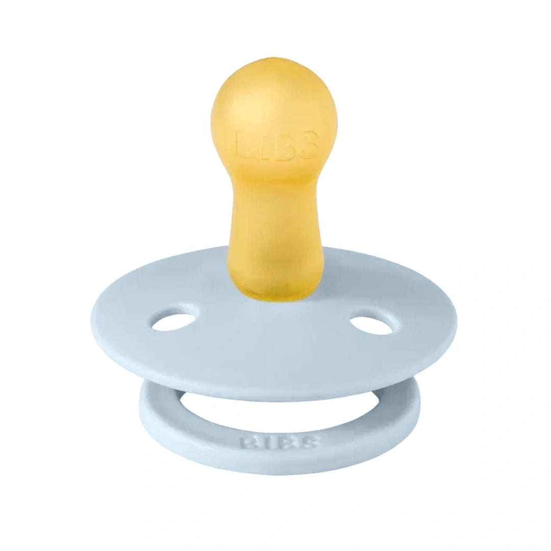 Baby pacifier with yellow teether and light blue body on a white background