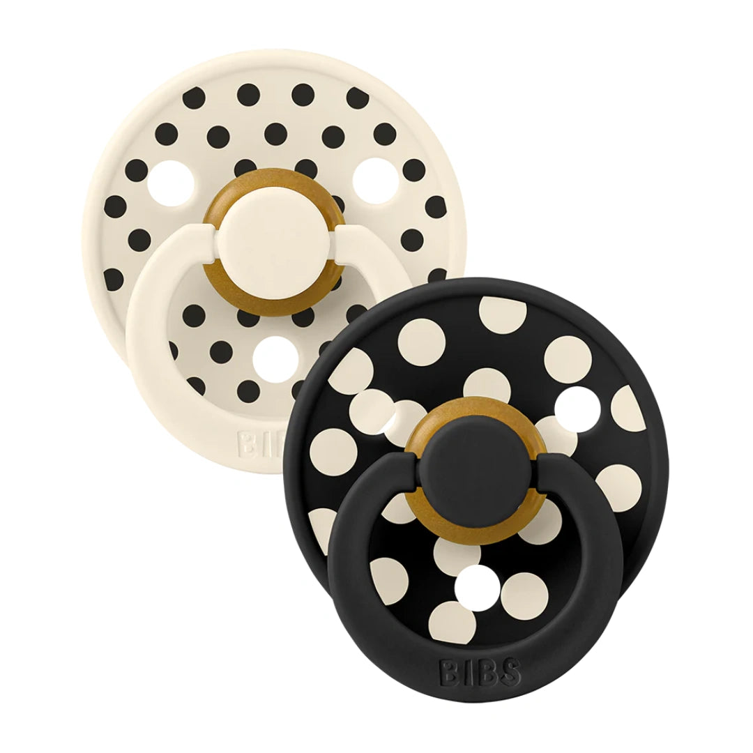 A breathtaking BIBS Studio Colour Pacifier 2-Pack in Polka Ivory/Black, showcasing its high-contrast shield and premium round natural rubber nipple