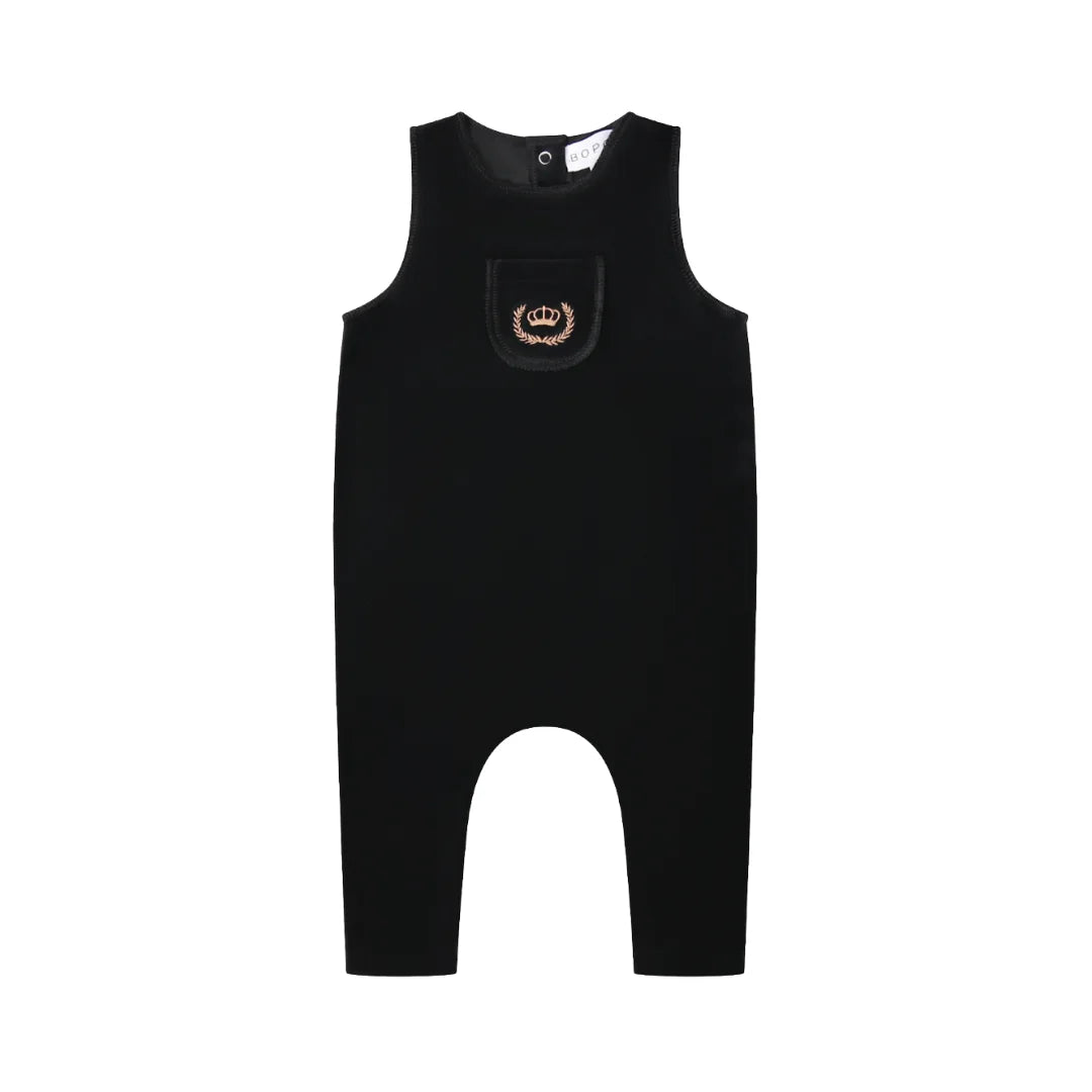 A front view of the black Bopop baby overalls featuring gold crown embroidery.