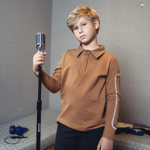 A person wearing the Byke camel denim patch polo comfortably