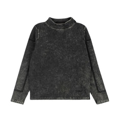 A front view of the Byke black wash patch mockneck sweater.