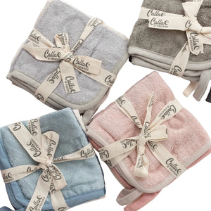 Four folded towels in gray, pink, blue, and beige with 'Callio' branding on a white background.