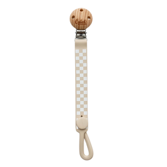 Wooden pacifier clip with checkered strap on a white background