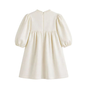 Clean back view of the cream C’era Una Volta Brigitte long-sleeve boutique dress for baby girls
