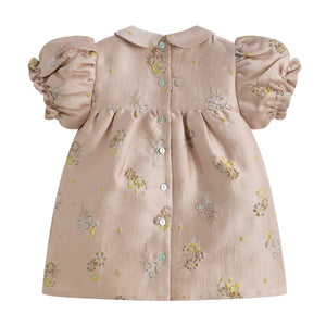 Pink dress with floral patterns on a white background