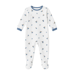 A flat-lay view of the Coton Pompom blueberry bambino footie in ivory.
