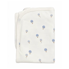 A flat-lay view of the Coton Pompom dreamy air balloons blanket in ivory.