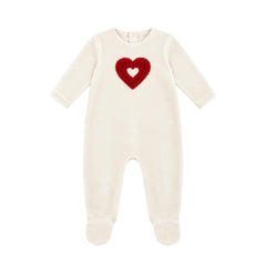 A flat-lay view of the Coton Pompom embrace heart footie in ivory and red.