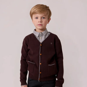 A stylish child wearing the Cottier brown cardigan