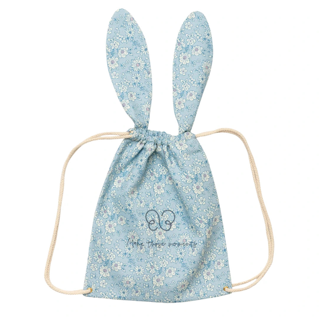A breathtaking Early Sunday Bunny Drawstring Backpack in Tonal Floral Blue, showcasing its authoritative architectural ears and sophisticated SS26 botanical print.