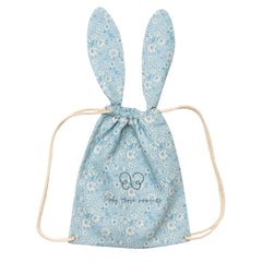 A breathtaking Early Sunday Bunny Drawstring Backpack in Tonal Floral Blue, showcasing its authoritative architectural ears and sophisticated SS26 botanical print.