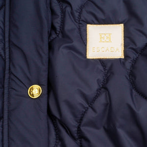 Navy blue jacket with a gold button and Escada label