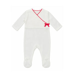 A flat-lay view of the La Mascot linen wrap footie in white and fuchsia.